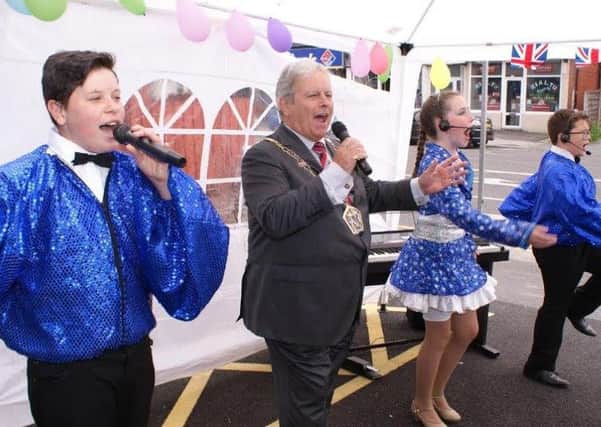 Mayor of Wyre Terry Lees and the Cosmic Kids celebrate the revamp of Fylde Coast Radio