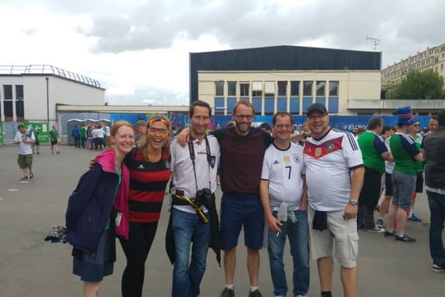 Jenny Simpson (left) and partner Ben Robinson with German fans at the Northern Ireland v Germany game in Paris, Euro 2016
