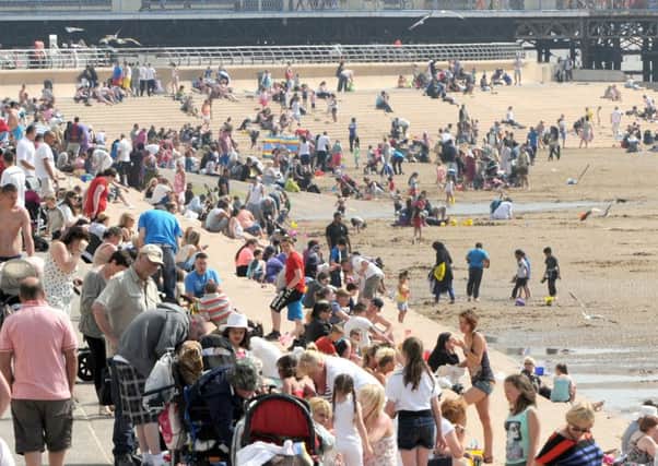 Pictures Martin Bostock
Crowds on Blackpool beach and promenade, Saturday 8th June 2013.