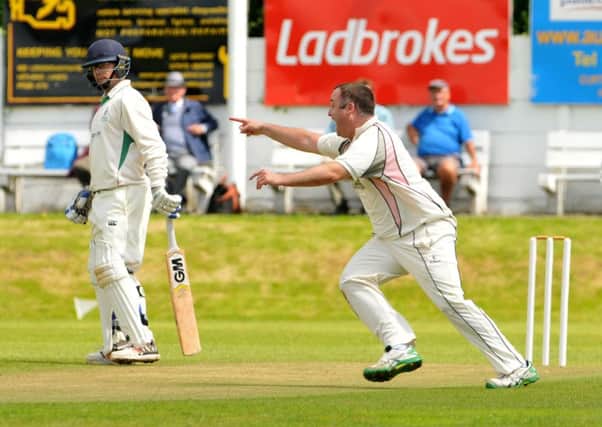 Andy Furniss takes a wicket for Blackpool at Leyland