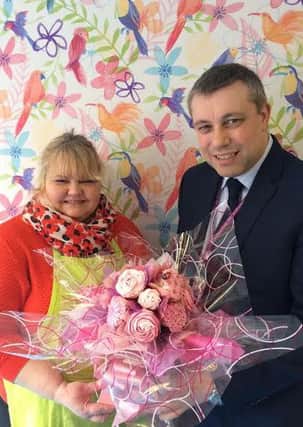 Jane Djuritschek with Coun Mark Smith and one of the bouquet cake displays from Cake-a Cabana caske shop Church Street