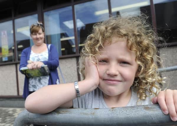 Nicky Frankland and five-year-old daughter Belle-Elise Parkin are concerned about the proposed closure of Cleveleys library