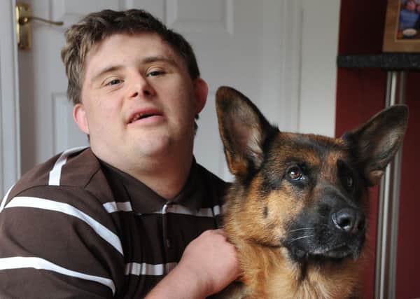 Wes Blundell, of Shaftesbury Avenue in Staining, has Downs Syndrome and has been given a new companion dog after the previous one had to be put down after only five months.
Wes with Ellie the German Shepherd.  PIC BY ROB LOCK
29-6-2016