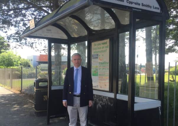 MP Mark Menzies at the bus shelter