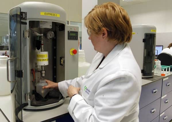 A technician  tests a sample of water at a United Utilities laboratory in Warrington