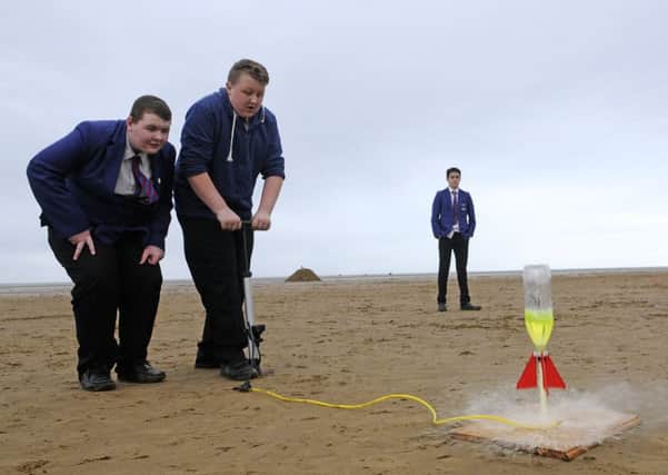 Pupils from Red Rose School take part in a world record attempt at launching bottle rockets.  Matthew Fisher and Lewis Palin.