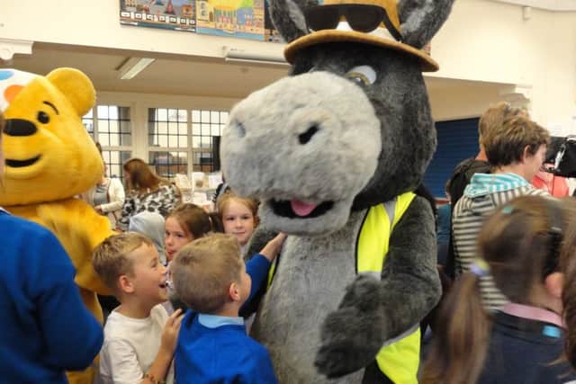 Young carers meet Blackpool Carers Centre mascot Rocco the donkey.