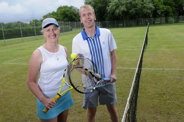 Shelagh Parkinson and Clive Parkinson try out the grass tennis courts at Stanley Park