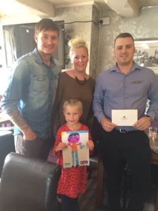 Mark Stockell, Maddison Stockell and Samantha Stockell were presented with their prizes by The Punchbowls  Manager Andy Melville.