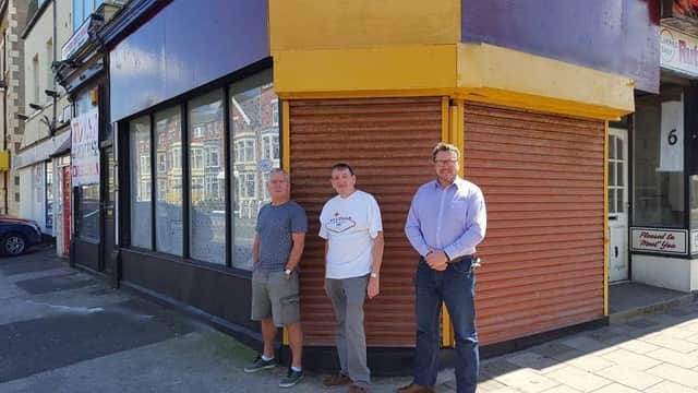 Charlie Docherty, John Morgan and Gerard Walsh outside the newly cleaned up shop premises on Coronation Street