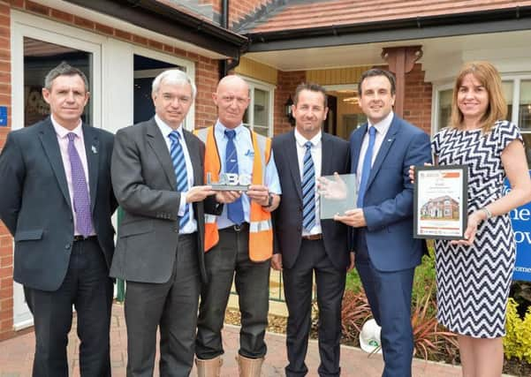 Mark Menzies MP with Simon Whittaker and members of the Jones Homes team and Fylde Borough Council building control department