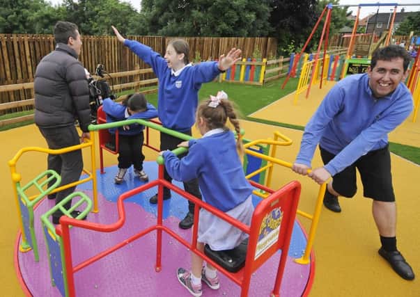 Opening of a new outdoor play area at Highfurlong School.  Some of the children use the facilities for the first time.