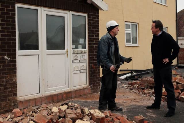Speaking to a builder after storms in Blackpool