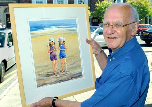 Lytham artist Tom Eccles  with his painting Gathering sea shells on Lytham beach