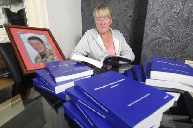 Karen Thornton with her copy of the Chilcot report