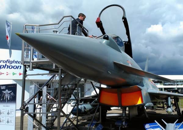 Visitors take a close look at the Typhoon and it weapon upgrades at the Farnborough air show