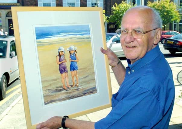 Lytham artist Tom Eccles  with his painting Gathering sea shells on Lytham beach