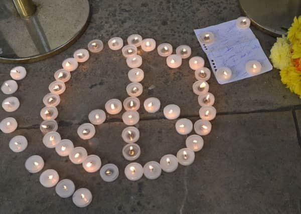 Candles are lit outside the French Embassy in London, following the death of at least 84 people, including several children, after a terrorist drove a truck through crowds celebrating Bastille Day in Nice. Pic: (Press Association)