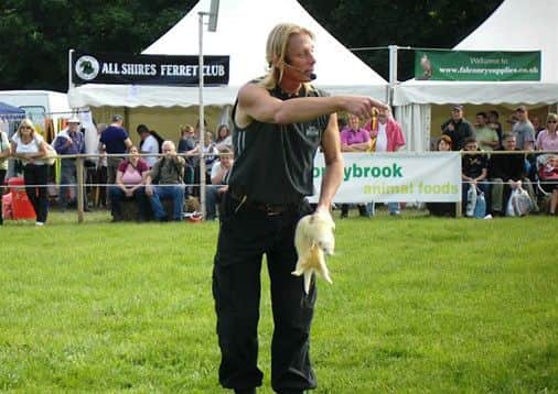 Simon Bishop introduces some of his ferrets to children and at country shows