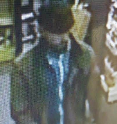CCTV image of thief who stole a purse from a woman with cerebal palsy in South Shore