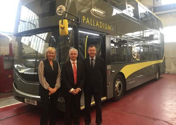 Mark Menzies with Blackpool Transport managing director Jane Cole and service deliver director Bob Mason