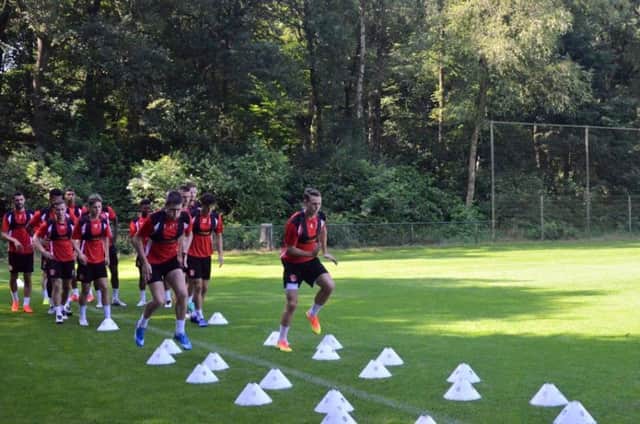 Bobby Grant and Eggert Jonsson lead the way as Fleetwood train in Holland