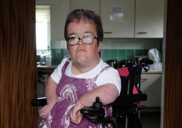 Sarah Finlayson has cerebal palsy and was robbed by a man who pretended to help her across the road