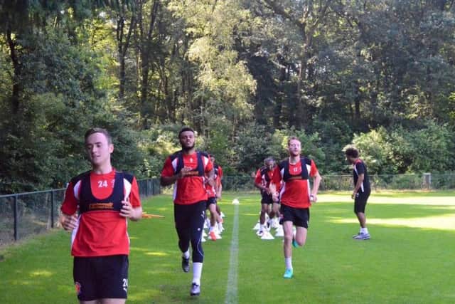 Thomas Grant, Aaron Holloway and Cian Bolger at the front of the pack during training in Holland