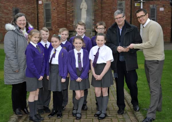 St Wulstan's Catholic Primary Year Six captains with left, Anne Benson representing St Wulstan's Church and right, Solicitor Alan Vincent and headteacher Richard Sanderson