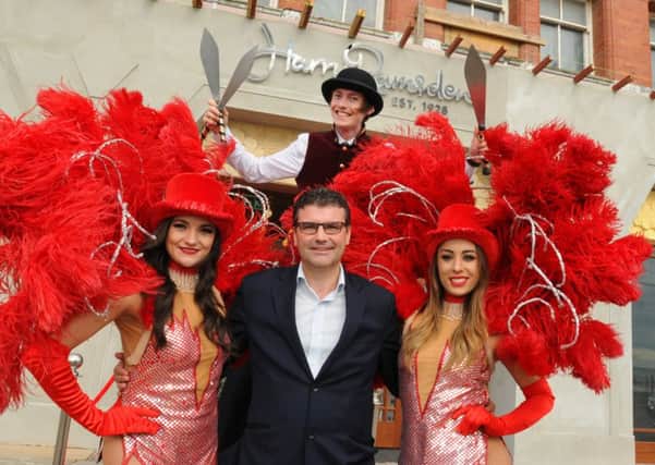 BLACKPOOL  25-07-16
Harry Ramsden chief executive Joe Teixeira, centre,  with entertainers welcoming guests at the official opening of the new Harry Ramsden restaurant and bar at Blackpool Tower.