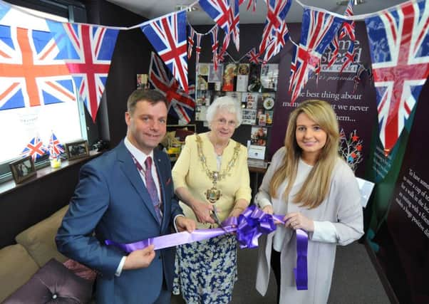 Fylde mayor Coun Christine Akeroyd officially opens the royal exhibition at the Memory Hub, flanked by Philip Higham and Melissa Hoyle of Home Instead