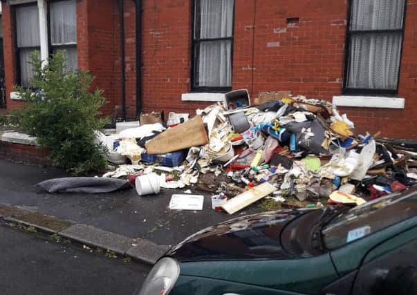 Skip company workers dumped rubbish in Braithwaite Street after the man who hired them failed to pay for the service. Picture by Allan Owen