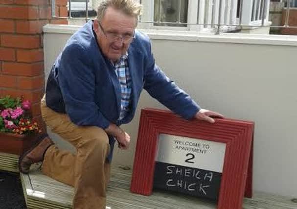 Mick Grewcock with his parking signs to welcom visitors