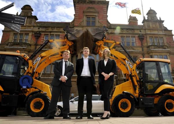 Coun Simon Blackburn, David Collett and Sian Collett with the Diggers outside Blackpool Town Hall in honour of Coun Eddie Collett