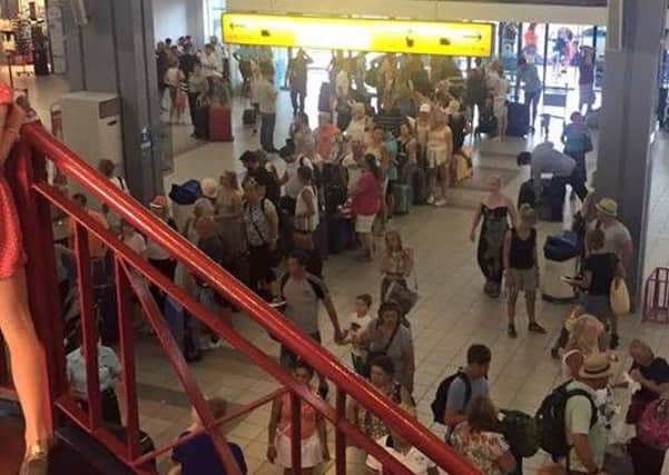 Passengers faced lengthy delays after their plane developed a fault. This shot, taken by frustrated Jack Watson, shows holidaymakers queing at Corfu Airport.