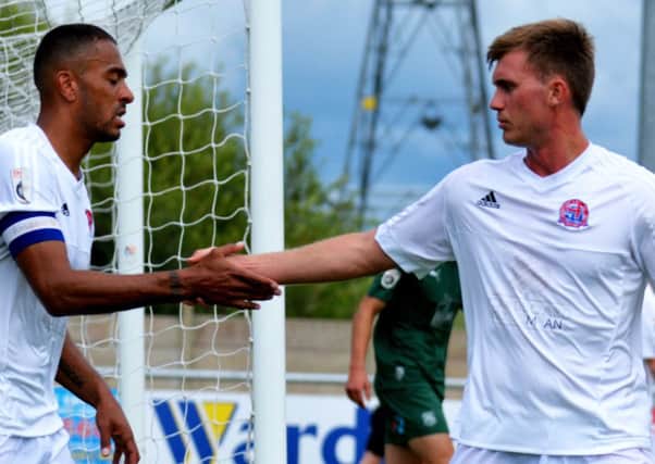 Steve Williams (left) with fellow central defender Josh Langley