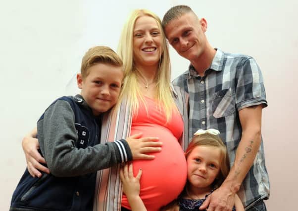 BLACKPOOL   04-08-16
Selina Curtis from Blackpool is having monoamniotic twins, a rare pregnancy that occurs in just one in 60,000, pictured with partner Scott Fleetwood, son Cyprus, nine, and daughter Lillie, six, right.
