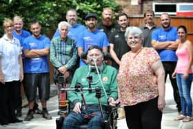 Keith and Kate Smith pictured at their Blackpool home with some of the people who have helped them