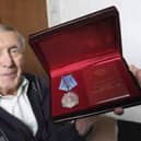WW2 veteran Peter Kyle is awarded a Ushakov Medal by attachÃ© of the Russian embassy Oleg Shor for his war effort in the Arctic convoys.