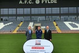 David Coates and Dean Tasker of BAE and (centre) Tom Hutton of the AFC Fylde Community Foundation