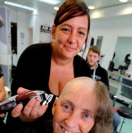 Joan O'Halloran from Fleetwood took part in the MacMillan Cancer Relief's Brave the Shave. Joan had her locks shaved off by Amanda Denney at the towns' Sun Spot salon. Joan has so far raised more than Â£750 for the charity. Picture by Paul Heyes, Monday August 08, 2016.