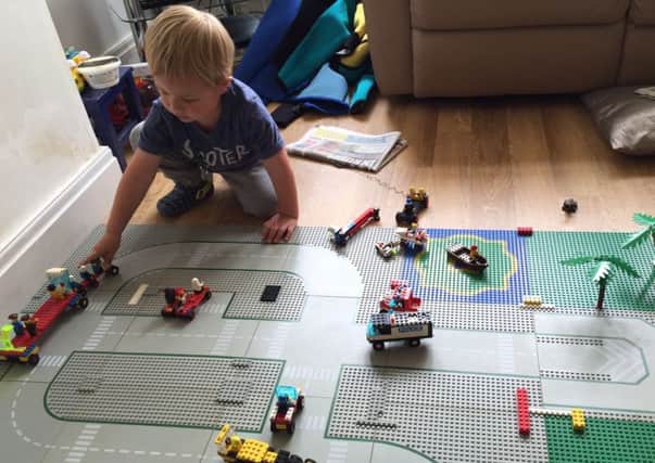 William Mellor playing with his lego