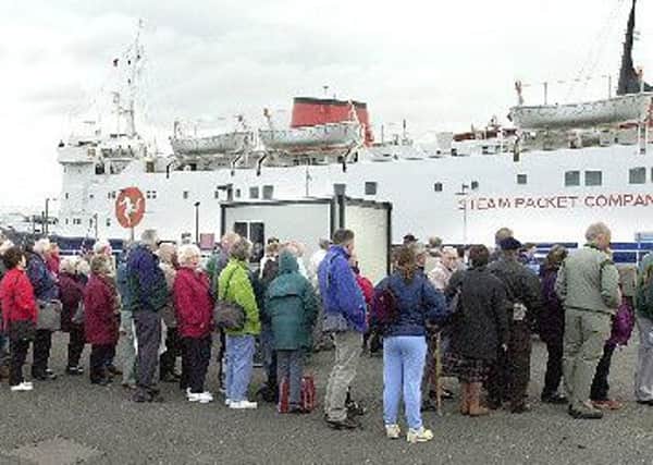 BIG DEMAND: Passengers at Fleetwood wait to board the ferry "Lady of Mann" during a sailing in 2002.