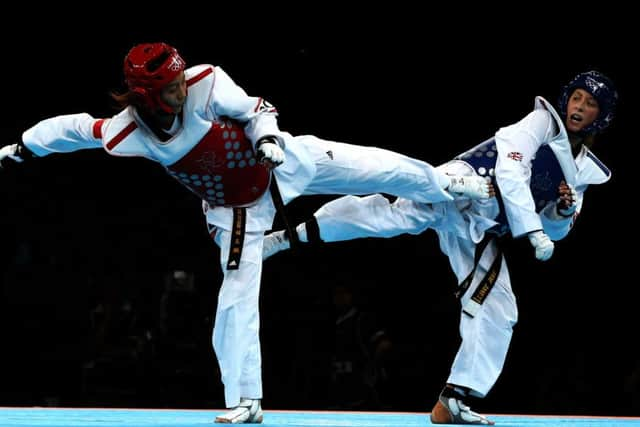 Great Britain's Jade Jones celebrates winning gold against China's Yuzhuo Hou in the womens -57kg gold medal taekwondo final.