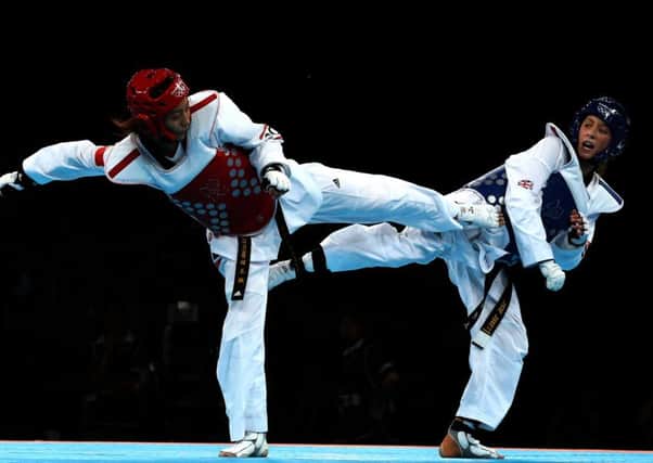 Great Britain's Jade Jones celebrates winning gold against China's Yuzhuo Hou in the womens -57kg gold medal taekwondo final.