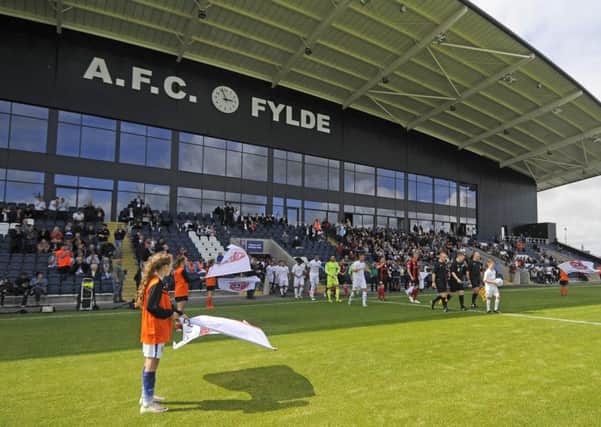 Players enter the Mill Farm arena for the first match