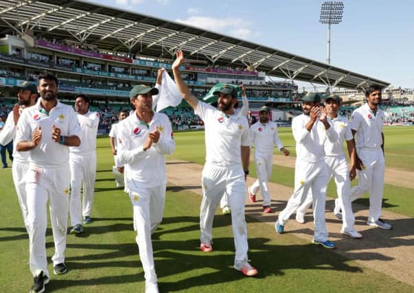 The Pakistan team walk around the ground after winning the match on day four of the fourth Test at The Oval