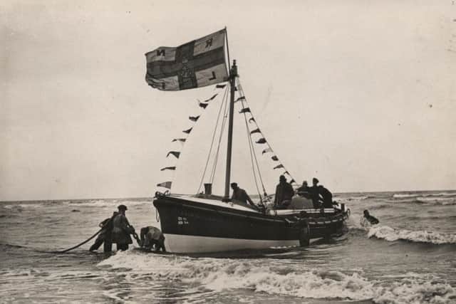 June 1937
New motor lifeboat touches beach