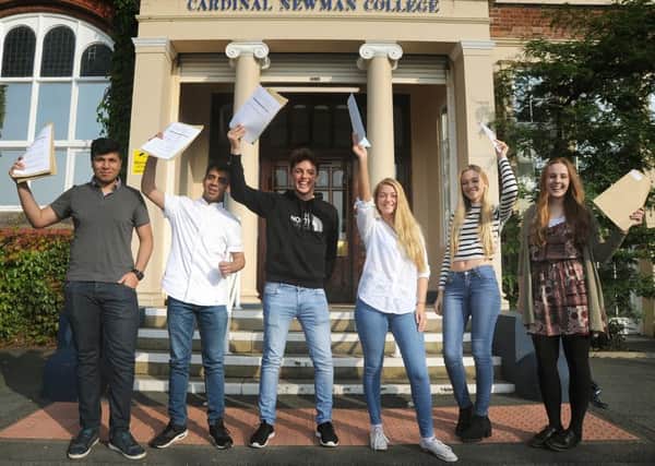 A level results day at Cardinal Newman College in Preston.
Celebrating a fantastic set of results are L-R: Adil Lakha, Samee Shahabi, Armando Chiarelli, Abbie and Amy Lunel, and Isla Neilson.  PIC BY ROB LOCK
18-8-2016