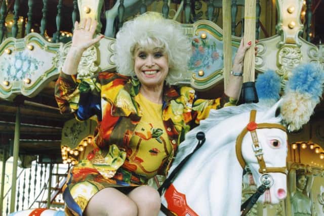 Barbara Windsor on the carousel on North Pier in  1992
seaside stars